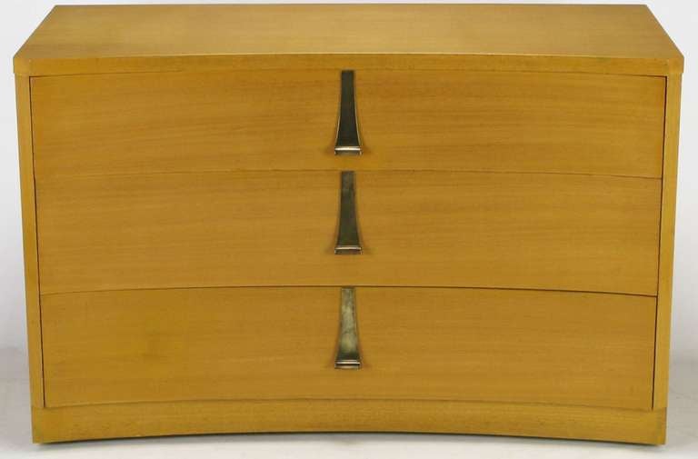Bleached and toned mahogany curved front three drawer chest, with sculptural brass pulls and canted corners. By Sieling Modern, of Railroad, PA, a fine furniture manufacturer with quality on par with Dunbar and Widdicomb. Due to their fine