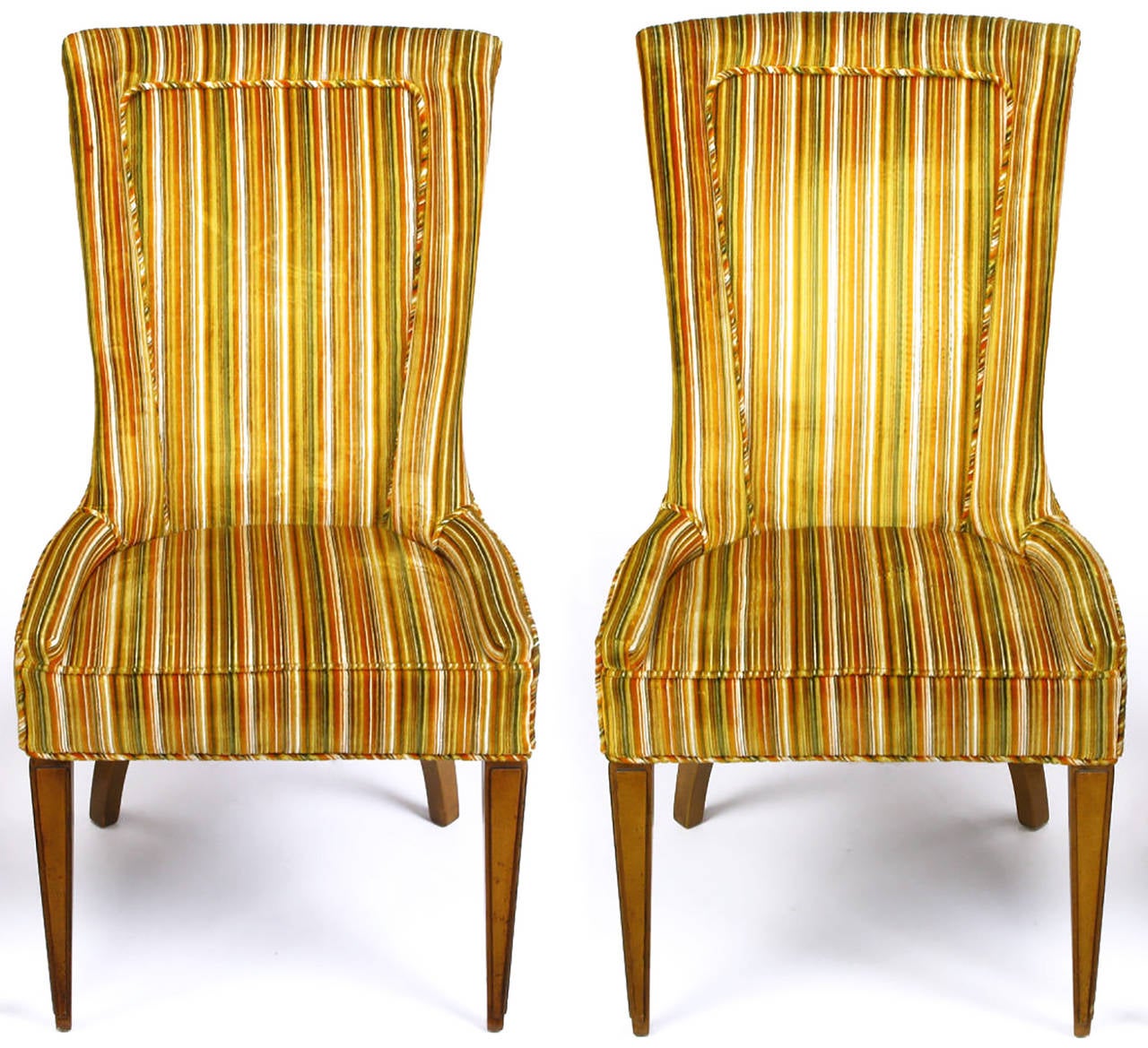 Pair of striped and cut velvet Empire style armchairs with inset seat cushions. Walnut carved and tapered front legs and canted curved back legs. Cut velvet upholstery striped in green, gold, burnt umber, brown and white. Excellent build quality, on