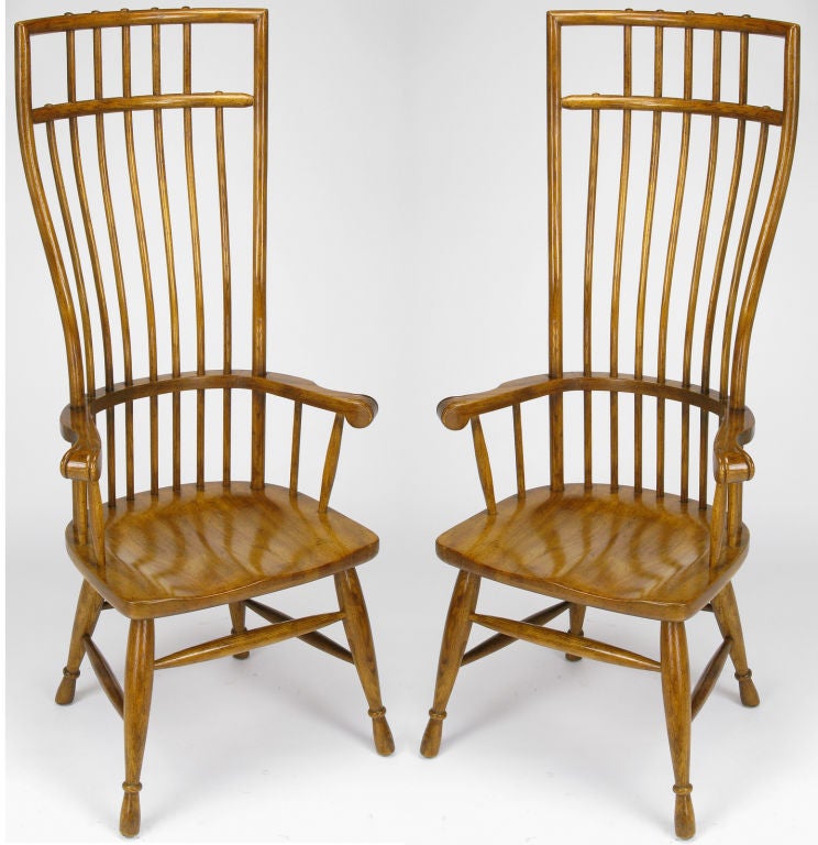 Set of six medium tobacco colored oak Windsor form dining chairs with curved dowel form fitting back and shovel seats. Beautifully styled seat backs are through dowels constructed; drum stick styled legs are connected by tapered end stretchers. Pair