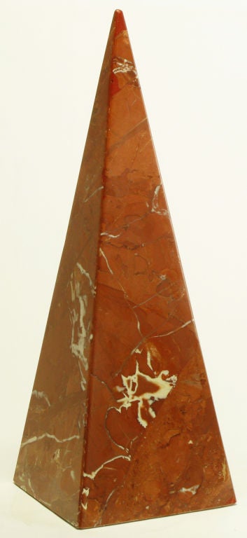 Tall pyramidal sculpture in rouge marble with excellent white and quartz veining.
