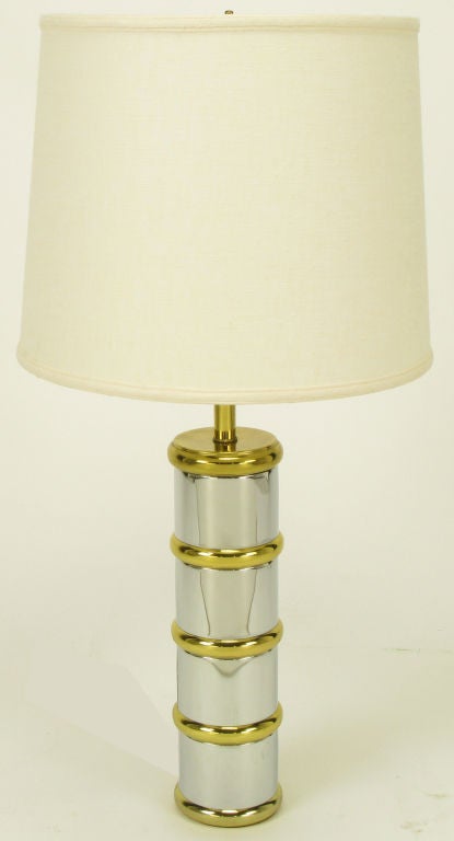Post modern table lamp with chrome column and brass rings, cap and stem. Similar to designs by Laurel Lamp.