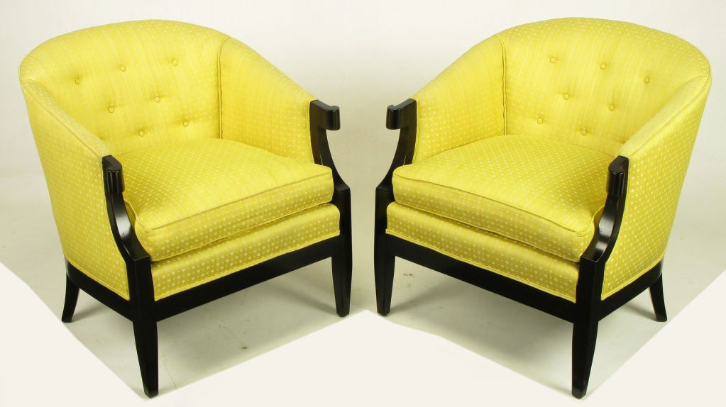 Designed by Winsor White and William Millington for Baker's 1954 Continental Collection, these arm chairs are upholstered in a vintage yellow embroidered silk fabric, with refinished ebonized walnut frames with turned arms and tapered front and back