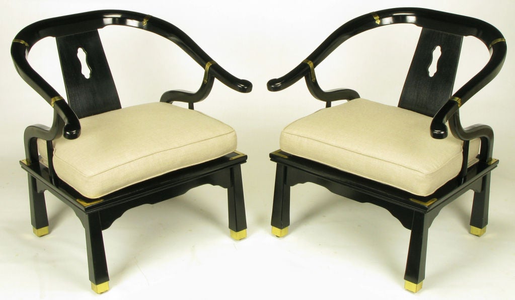 Pair black lacquer and linen upholstered loose cushioned seat yoke back chairs with tapered legs brass sabots and brass banding. Larger than similar styled chairs at 32.5