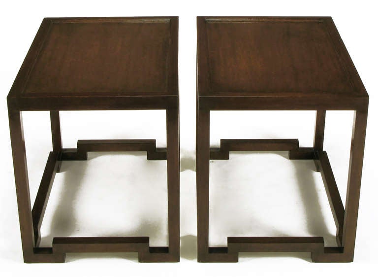 Pair of Asian-influenced modern mahogany side tables with unexpected split-level lower stretchers. Clean lines with recessed mahogany tops and Dunbar level build quality. Used longitudinally, they would make excellent nightstands/night tables.