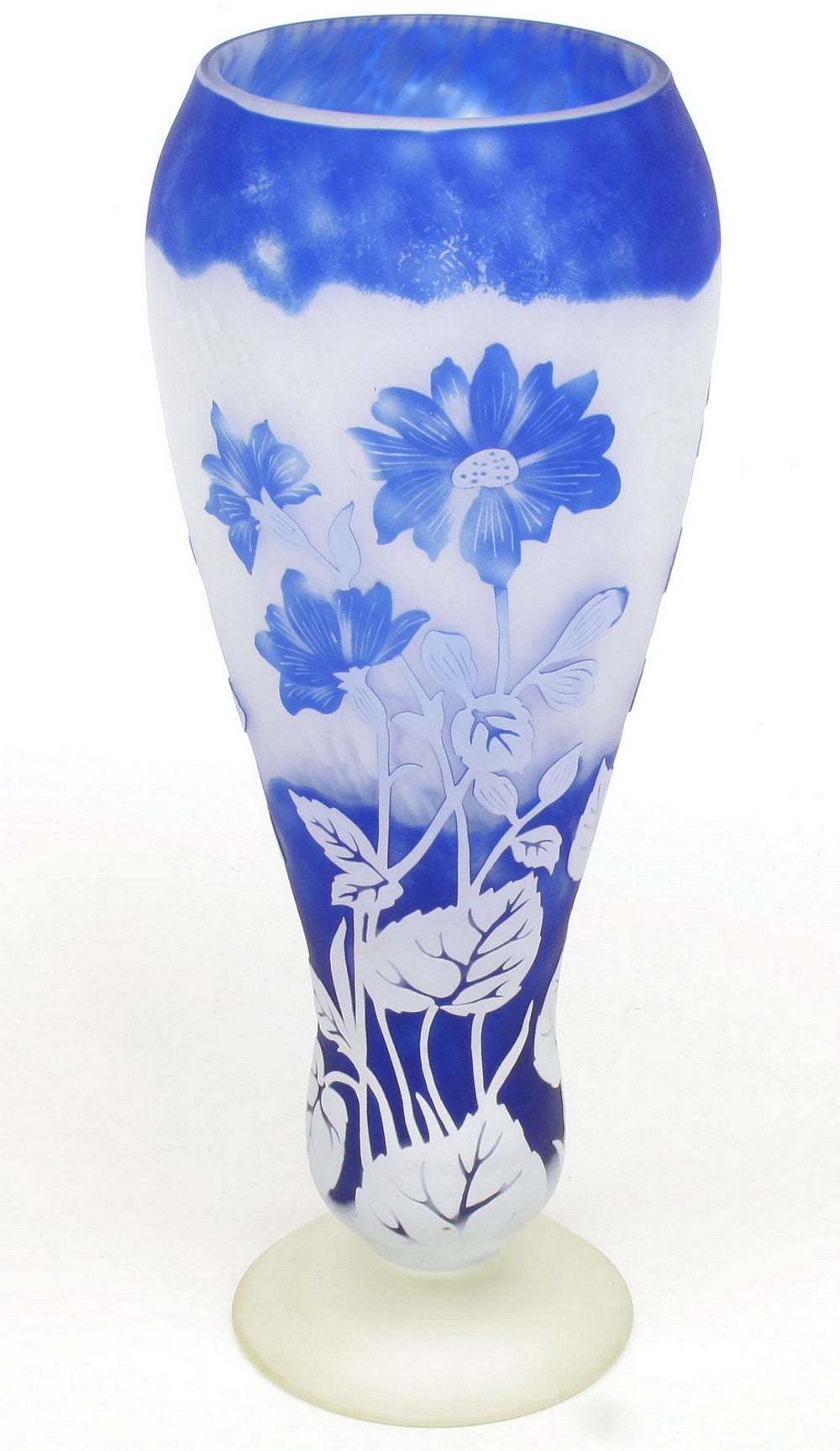 Shannon of Ireland cut art glass with floral design. Cased glass of blue and clear is cut and sandblasted to various depths. Mouth blown and hand-cut.