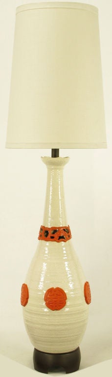 Monumental white ceramic vase form table lamp with crackle glaze finish and red glazed Asian style characters. Base is carved wood, stem is lacquered black with a patinated brass cup and milk glass diffuser. Nardini Studio was a fine ceramic