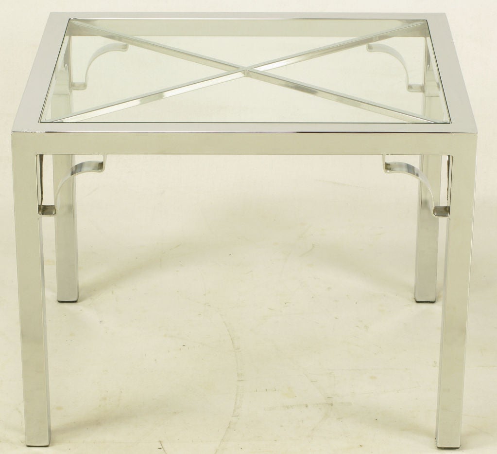 Chrome Parsons style side table with Chinese Chippendale open corner brackets. The top is glass with an X-pattern support. Often mistakenly attributed to Milo Baughman.