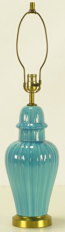 Turquoise ceramic table lamp with brushed brass base. Ginger jar form with ribbed detailing, brass stem and socket. Sold sans shade.