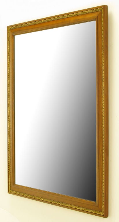 Understated and elegant wall mirror from Kindel Furniture. Bleached walnut frame with parcel gilt gesso inlaid detail. Great powder room as well as over mantel piece.