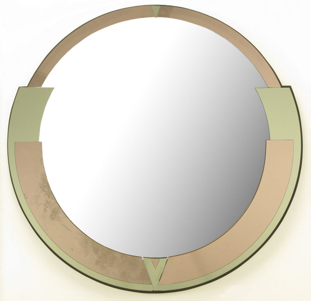 David Marshall art deco revival round mirror on black lacquered wood backing. Aged rose colored mirrored glass layered with silvered mirror glass. Signed at V shaped lower chevron detail.