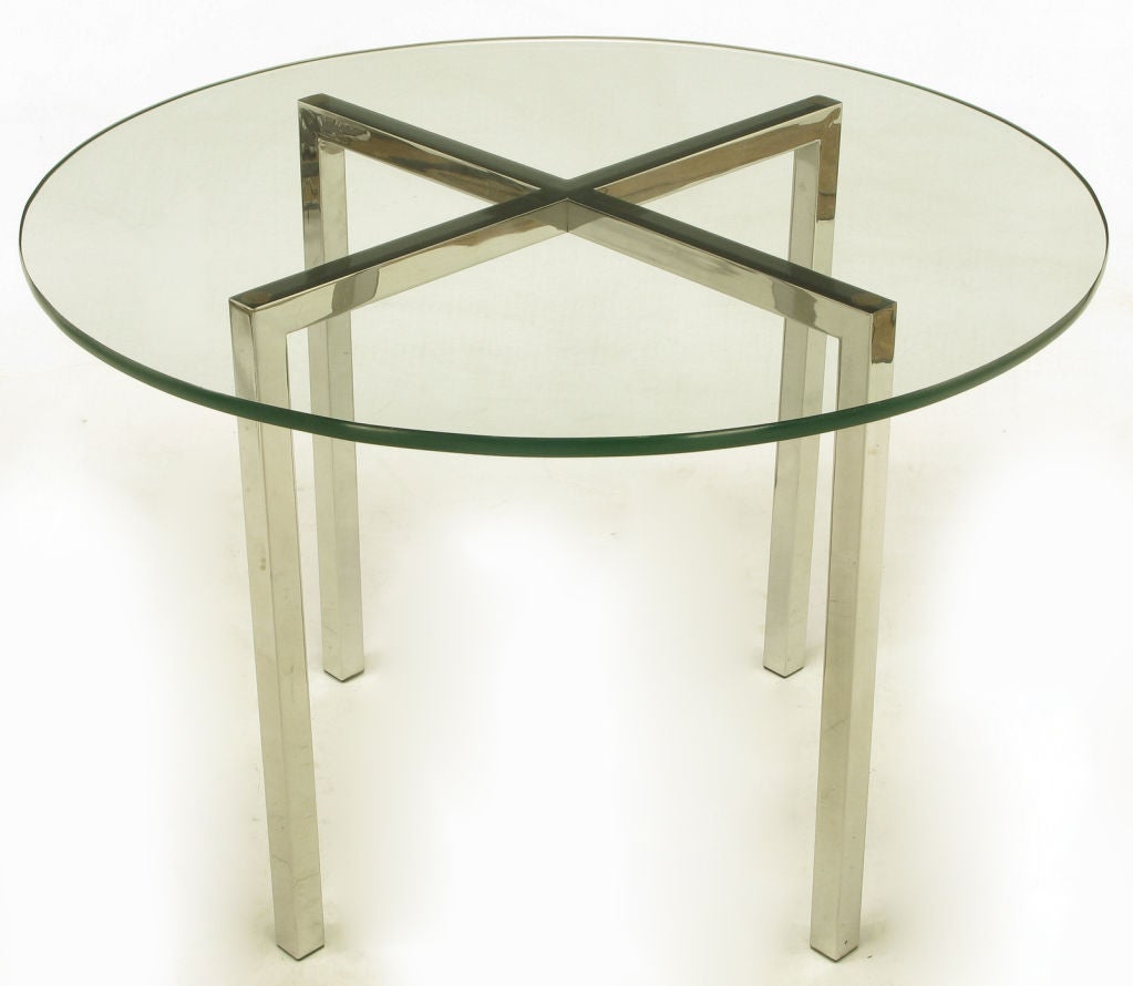 Chromed square tube X-frame dining table base evocative of the Barcelona Table by Mies Van Der Rohe. Round glass top is 3/4