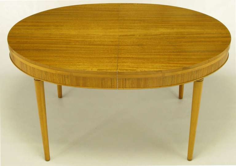 Radiant primavera mahogany with striped grain and racetrack oval shaped dining table. Single 12