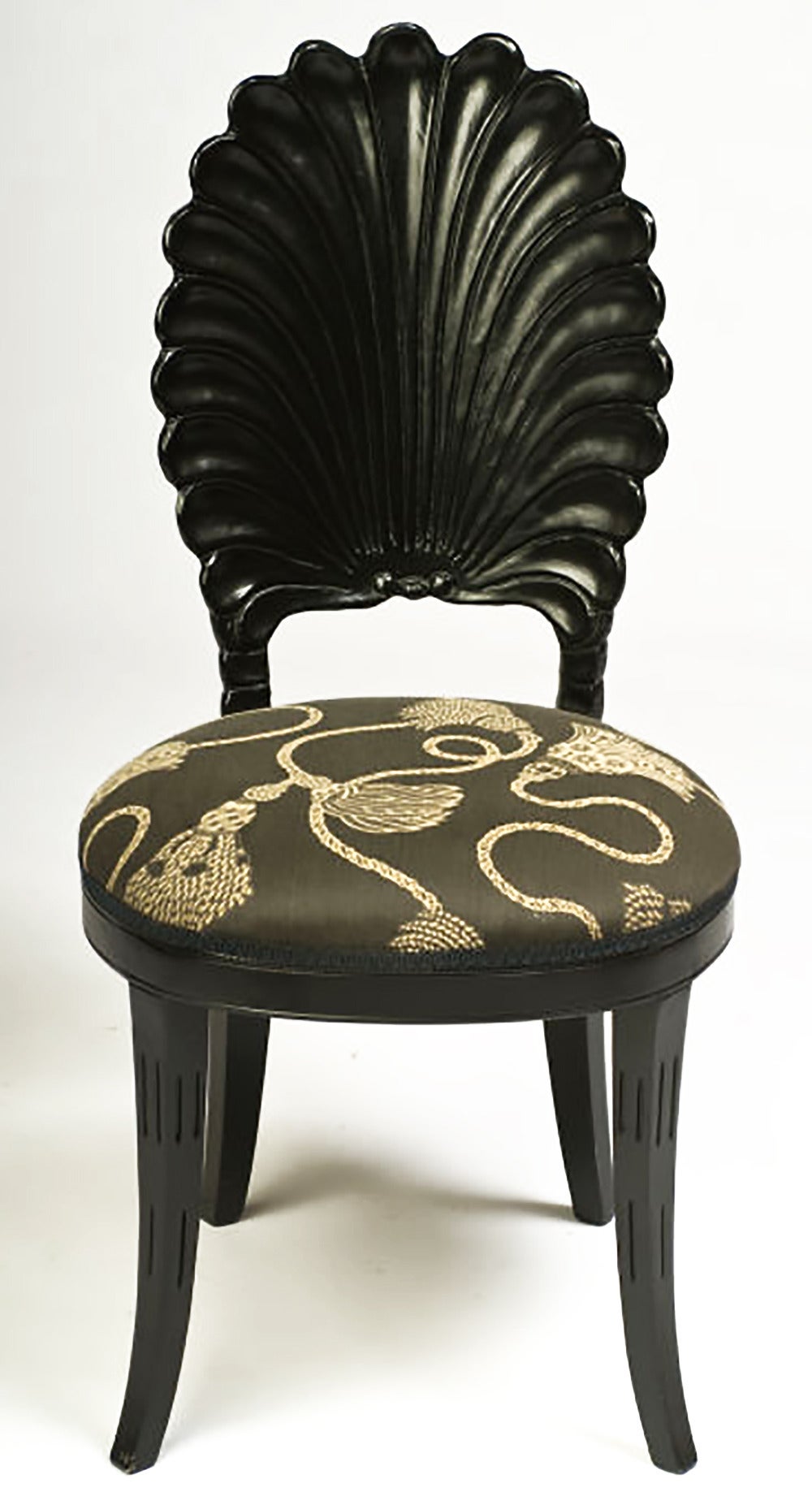 Set of four Italian wood grotto chairs, hand-carved and ebonized. Upholstered in a dark charcoal cotton/silk fabric with cream cord and tassel pattern.