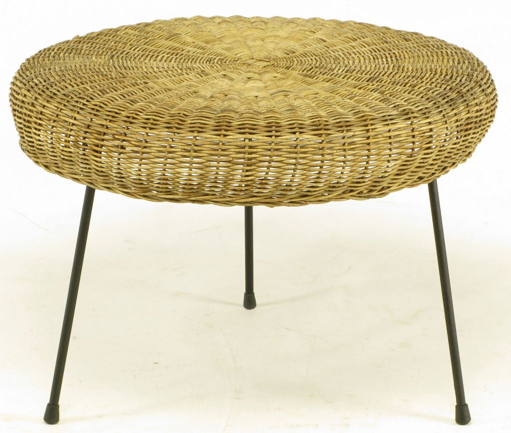 Arrtibuted to Mario Tempestini for Salterini, round wicker inverted tray and black wrought iron tripod side table or stool/ottoman.
