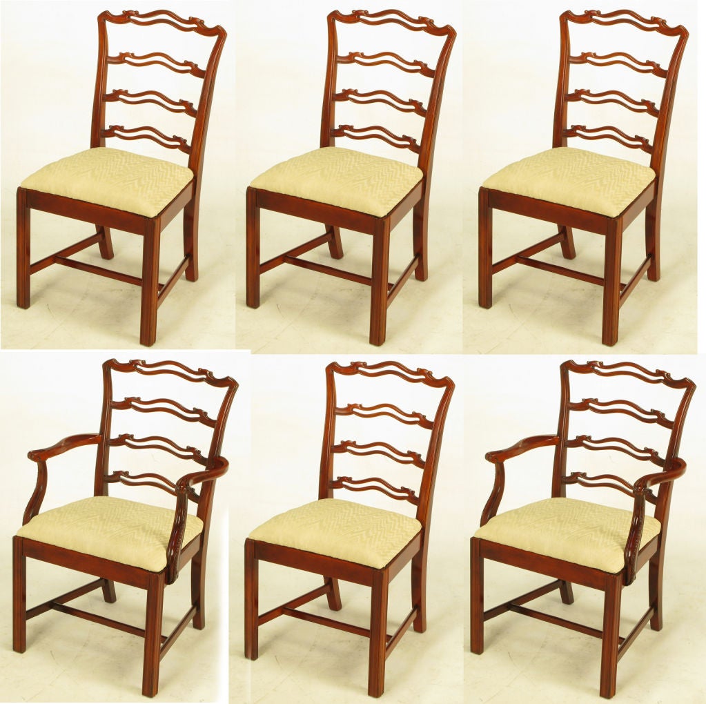 With a sturdiness that belies their delicate appearance, these elegant dining chairs are constructed of maple.  The openwork backs give them a lighter feel than most Chippendale dining chairs.  Four side chairs, and two armchairs.<br />
<br