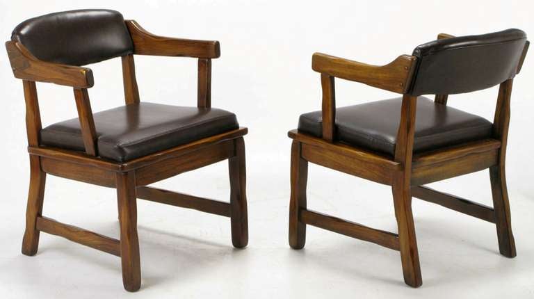 Sculpted dark oak dining chairs with a 