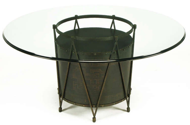 Unexpected bronze-plated drum table base with Greek key design. Six legs come together with the repeated V-shape bronze plated iron bar supports. Top and bottom banding on the drum body is detailed with bronze studs. Can be used as a games table or