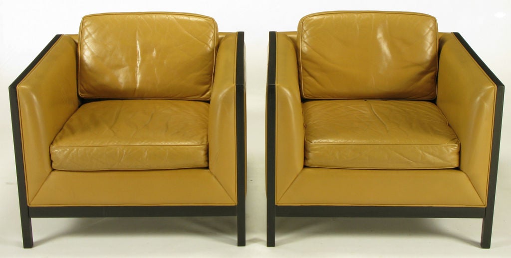 Pair of Stow Davis of Grand Rapids Michigan, even arm club chairs in camel leather with ebonized ash wood framing and aluminum inlaid detail. Loose seat and back cushions. We also have the matching even arm sofa available.