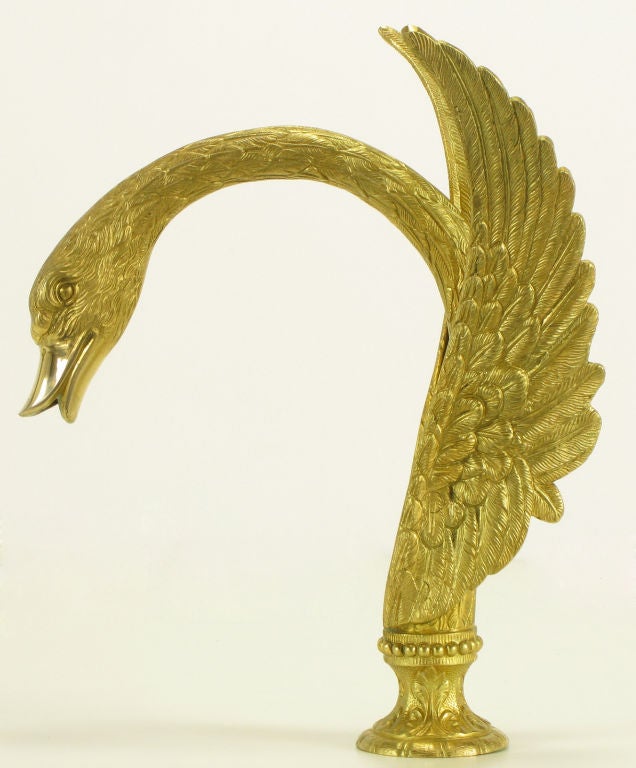 Gold plate over cast bronze swan form faucet by Sherle Wagner. Long neck and open wings create a substantial faucet for the exceptional bath tub.