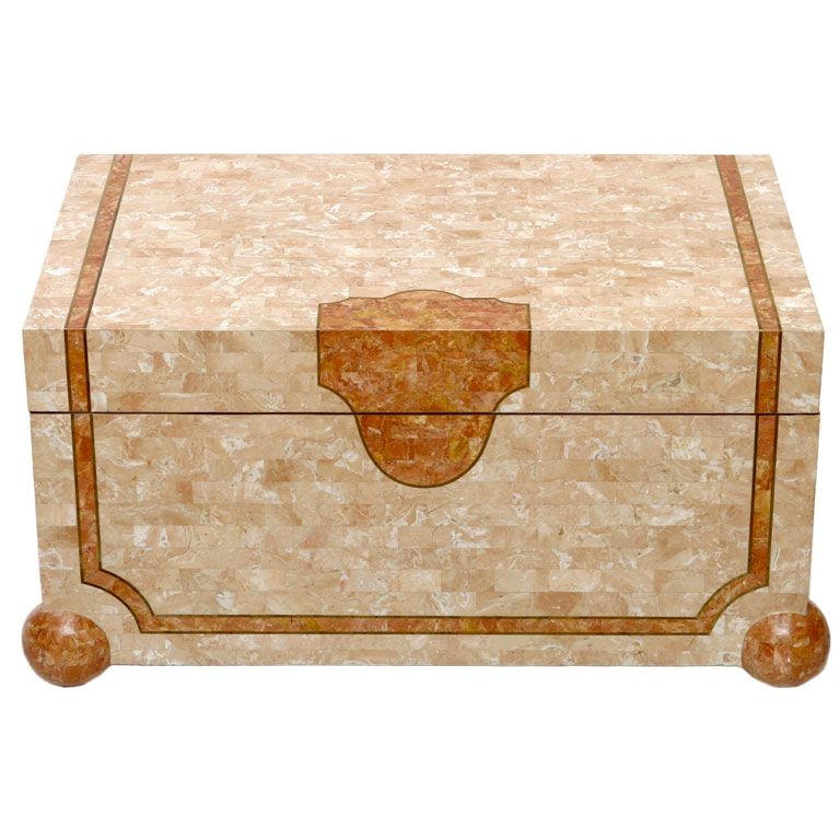 Robert Marcius for Casa Bique exquisite trunk sized box that can be used as a table. Covered in tessellated stone of contrasting coral shades, with ball form feet adding sculptural detail. Brass inlay complements the design elements.

Casa Bique