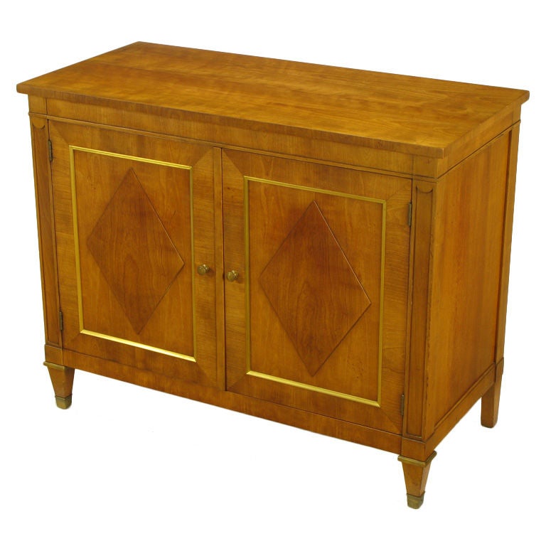 Figured Walnut 
Parcel Gilt Regency Cabinet