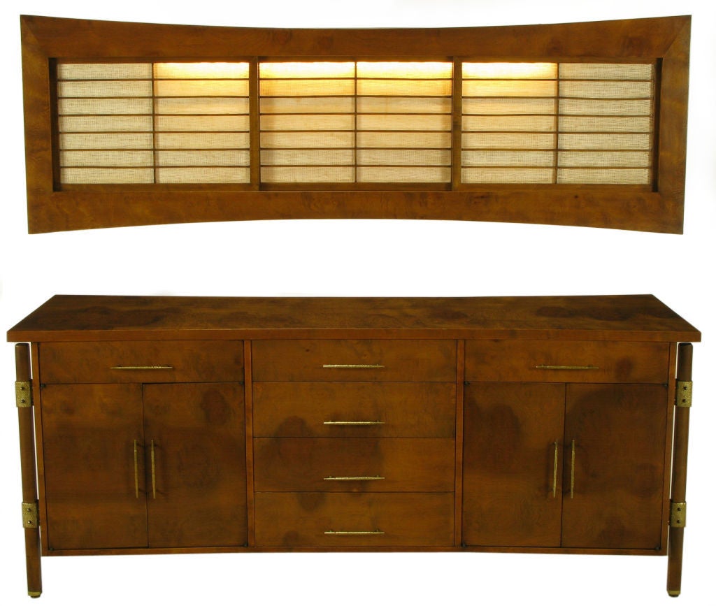 Designed by Harold M. Schwartz for Romweber.  Burled walnut side board with fiddle back highlights. Rustic textured brass hardware, including brackets connecting the outboard legs to the case. Sideboard features long pulls on the six drawers and two