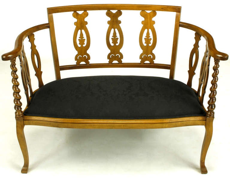 Carved cherrywood Georgian style settee with barley twist arm supports with open fretwork back and sides. Black silk damask upholstered seat.

 