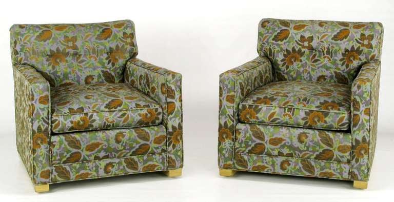 Unique sled based, button tufted, clean lined club chairs in a vivid needle point floral upholstery of greens, rust, lavender, light blue and black. Bleached mahogany parallel sled leg are substantial and characteristic of American art deco designs