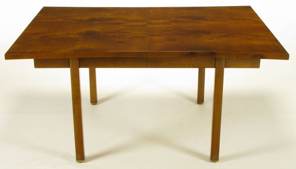 Convex-curved sides burled walnut dining table, by Harold M. Schwartz for Romweber. Clean lined apron and legs with the addition of two leaves the total possible length is <br />
 96