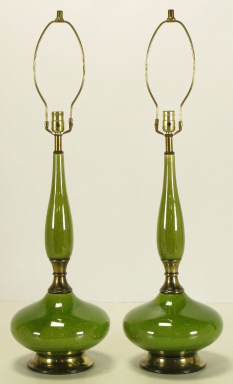 Uncommon heathered green glazed table lamps, with stylized gourd form bodies. Patinated brass base, spacer and stem. Brass stem and harp.