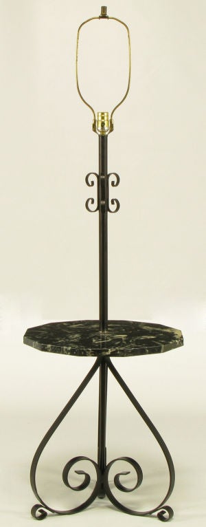 Moorish style black wrought iron three-leg floor/table lamp. Black wrought iron base and stem. Black marble with white and grey veining, dodecagon table top.