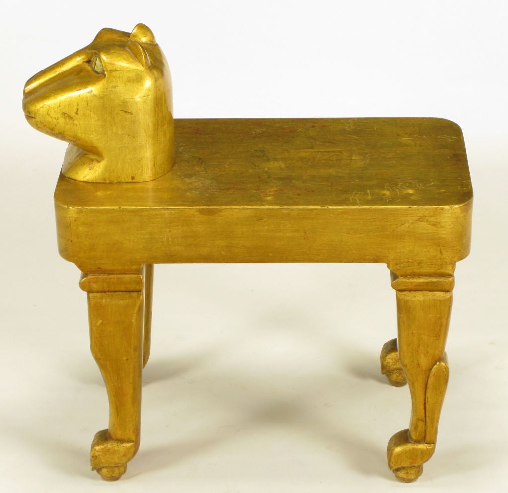 Art as furniture in the spirit of Pedro Freideberg, a carved and gilt cat table or bench perched atop four carved balls. Mayan style carved feline visage, well made with excellent build quality.
