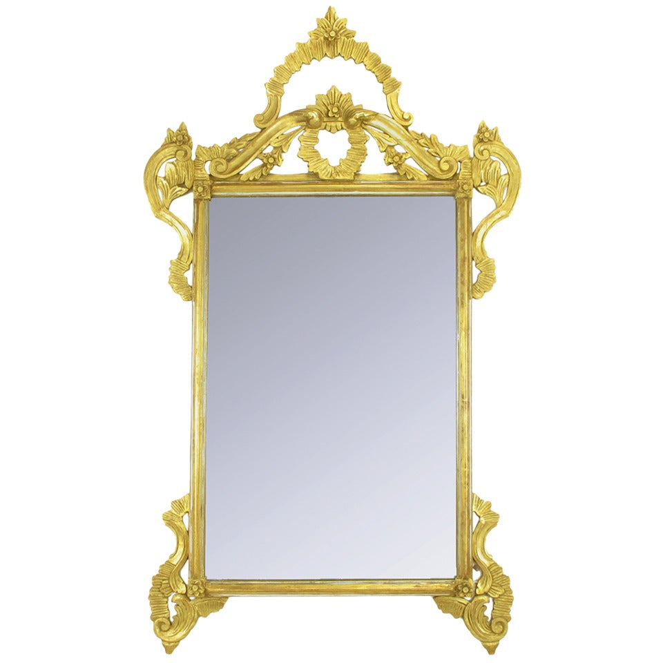 Miroir italien de 60 pouces en bois sculpté et doré à la main.