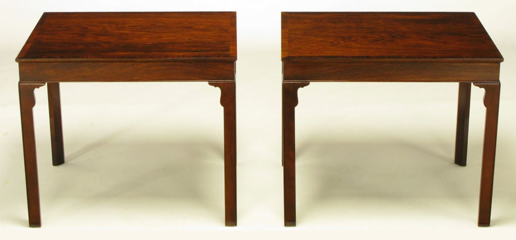 Pair of 1940s rosewood and mahogany end tables custom built for John A. Colby & Sons, for generations the finest furniture retailer in Chicago. Superbly grained rosewood top with cross grained rosewood edging and rosewood apron. Carved triangular