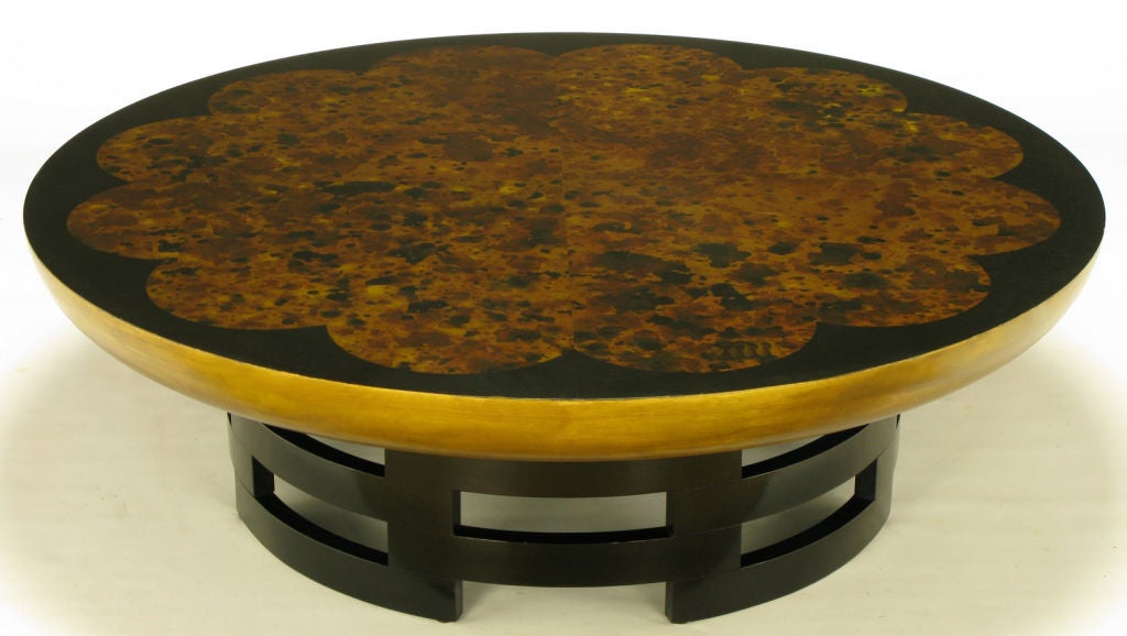Theodore Muller & Isabel Barringer for Kittinger Lotus coffee table. First issued in 1940, an iconic Kittinger coffee table with open cylinder black lacquered wood base and gilt. black lacquered and oil drop finished wood top.