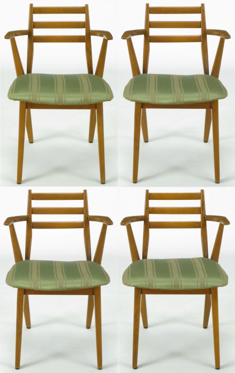 Striking set of four arm chairs by Jan Kuypers for Imperial Contemporary of Canada. Constructed of solid birch wood with racing striped green silk and linen upholstered seats. Three slat open back with the back leg extending up to become the arm