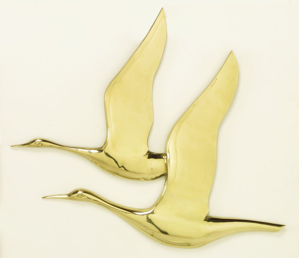Polished brass pair of herons in flight wall hanging after C. Jere