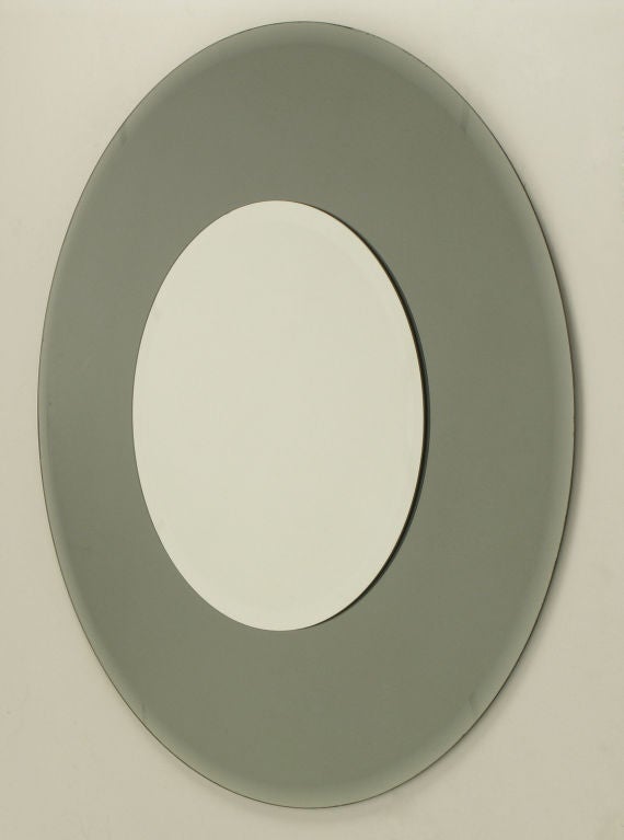 Art Deco revival round smoked mirror framed around mirror. Bevelled mirror frame as well as bevelled interior mirror. Measures: 36