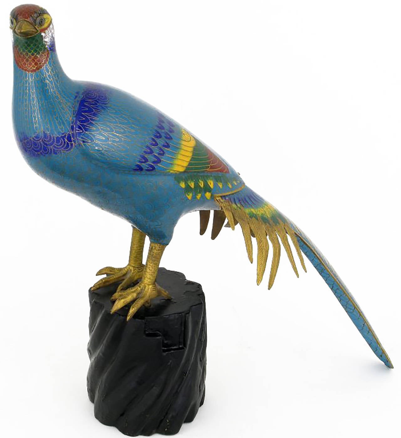 A wonderful and large cloisonne pheasant in beautiful shades of blue, yellow, red and green inlaid enamel, surmounted on a carved and ebonized wood base.