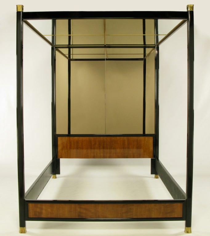 Henredon Furniture black gloss lacquer and walnut queen canopy bed with brass feet and finials. Bronze toned mirror over the black lacquer and walnut head board is fixed to the back and  the brass framed and mirrored ceiling is as well. The canopy