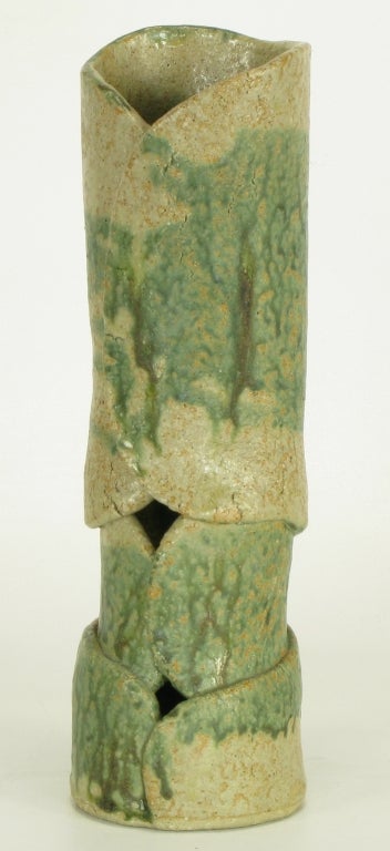 Three part hand thrown earthen pottery vase finished in a sage green drip glaze by William August Hoffman (1920-2011).



Hoffman was a respected artist, and professor of ceramics and sculpture at the Art Institute of Chicago and Loyola