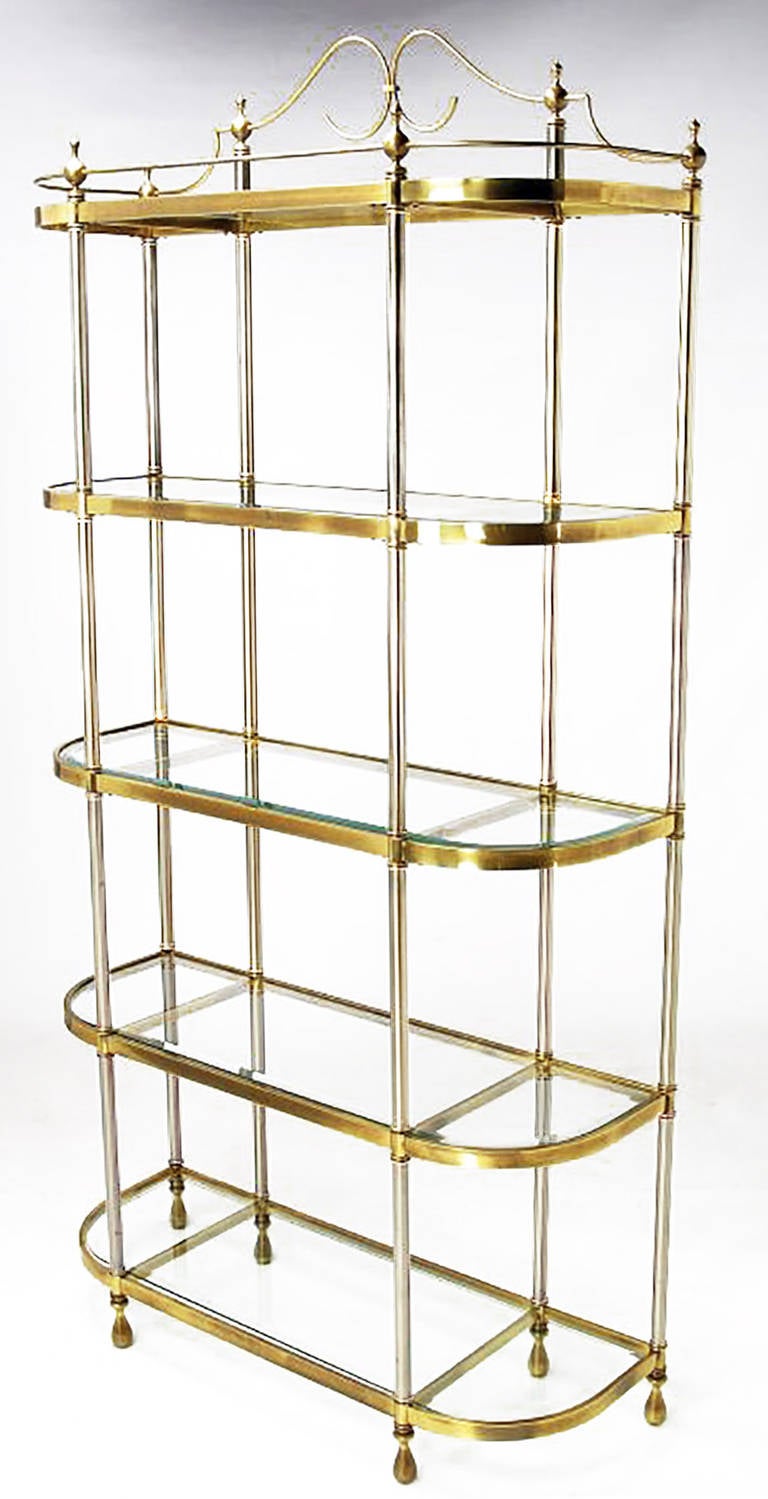 Regency brass and brushed steel five-shelf etagere with curved sides and beveled glass shelves. Each of the vertical supports is surmounted by minaret form finials that embrace a brass gallery rail. Versatile piece that can work in the kitchen,