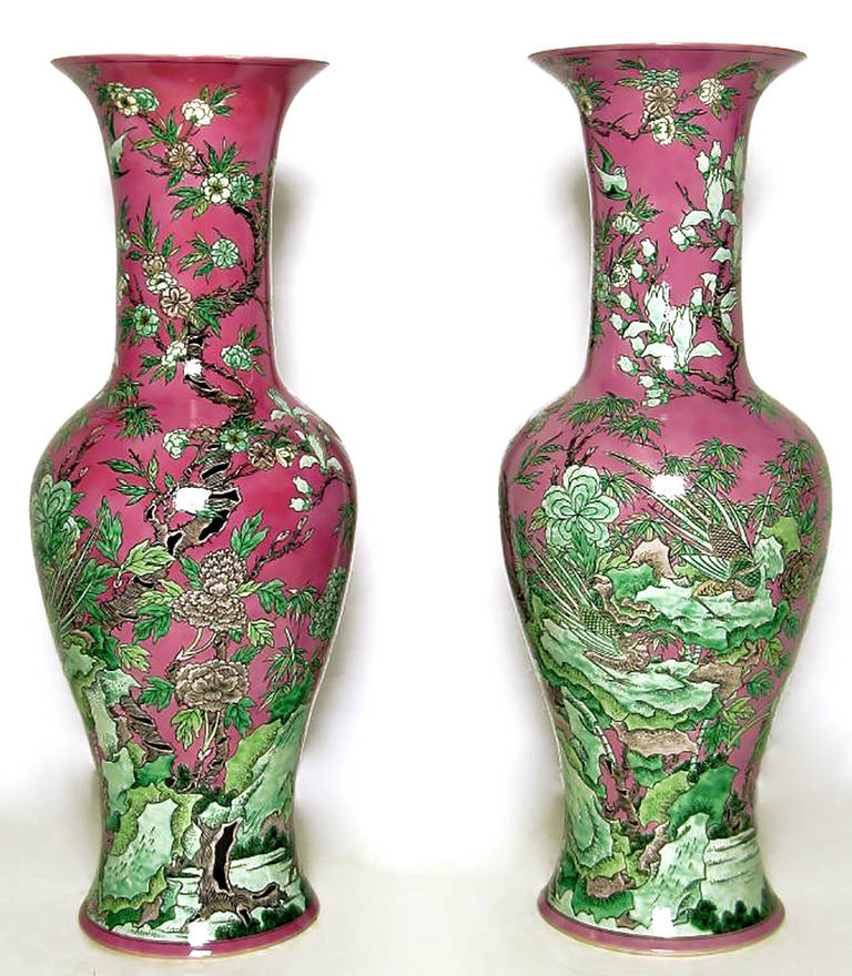 Custom-made for the original owner in Hong Kong to match her decor, these large porcelain floor vases are in a traditional Chinese form. Hand-painted, with white interior glazing. Measures: 2 inches short of 3 feet tall.