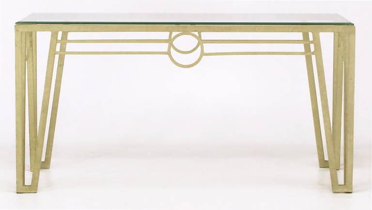 French Art Deco fer forge inspired open legged iron console table has circular details on all four sides. Patinated and textured lacquered finish. Beveled edge glass top one-half inch thick.