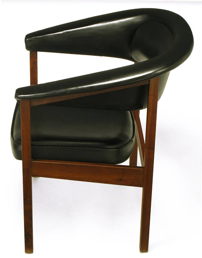 Walnut frame and excellent quality black vinyl upholstered desk chair with a rolled arm barrel back and cantilevered seat. Comfortable and striking desk chair.