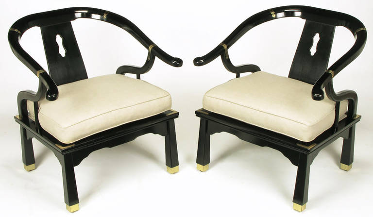 Pair of black lacquer and linen upholstered loose cushioned seat yoke back chairs with tapered legs brass sabots and brass banding. Larger than similar styled chairs at 32.5
