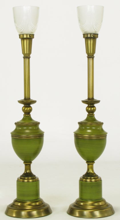 Pair of antiqued brass and striated olive green lacquer Empire style table lamps after Rembrandt.  Brass and lacquered base with brass spacer and urn style lacquered body. Brass stem and milk glass diffusers.