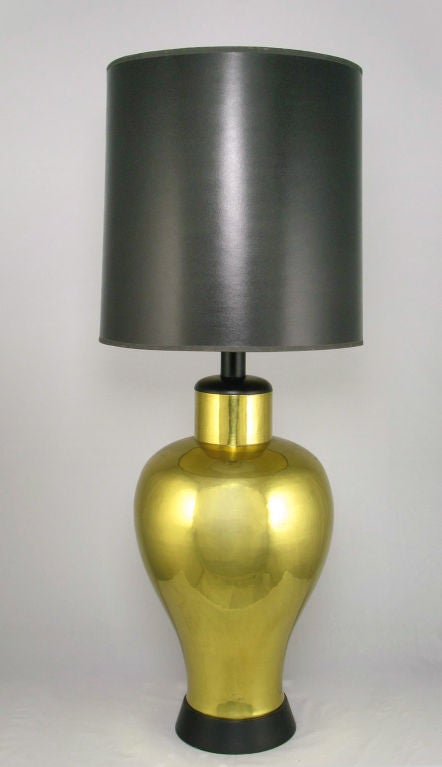 From an estate replete with Tommi Parzinger and Paul Evans pieces, these table lamps are rather monumental and impeccably crafted. Artfully spun brass bodies, with black lacquered base, cap and stem. Sold sans shades.