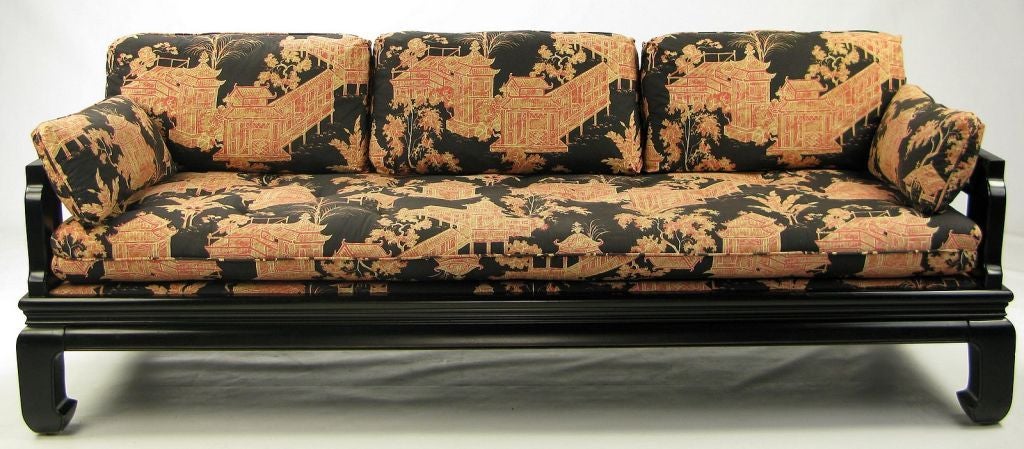 With its original black, red, cream and coral linen upohlstery in a chinoiserie design, this sofa has a striking design that incorporates both traditional Chinese elements, as well as western influences. Would also work well as a daybed, in the