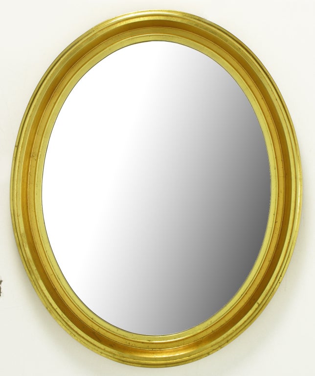 Well made wood and gesso mirror oval mirror with two distinctive tones. Great size and shape for a powder room or entry way, over console, mirror.